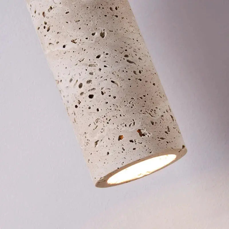 Bedside pendant light, beige cylindrical with porous concrete texture, Simples Market.