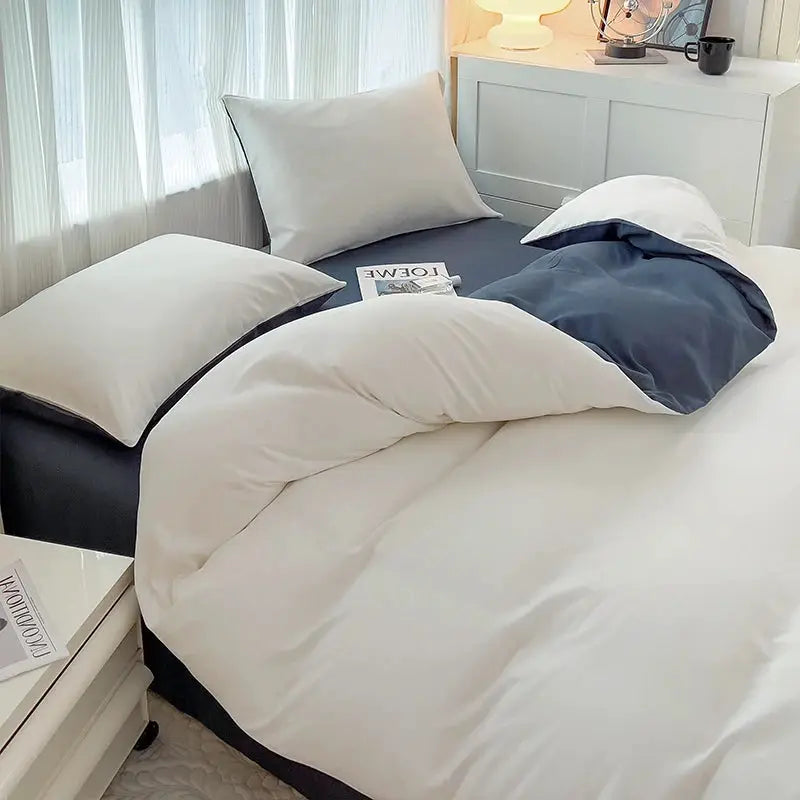 Simples Market 4-piece brush fabric bed set with white duvet cover and dark blue reverse; pillowcases included.