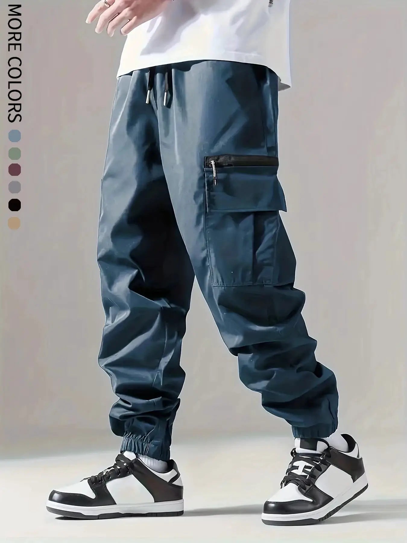 Men's cargo pants, navy blue, lightweight breathable fabric with drawstring waist and zippered cargo pocket.