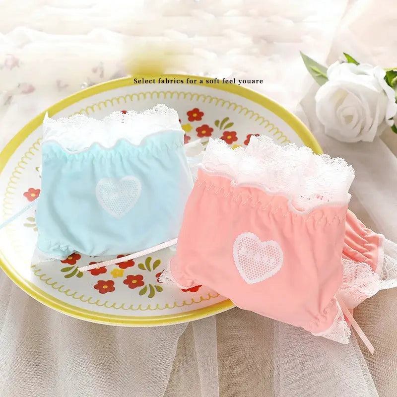 Two pastel panties in blue and pink with white lace trim and heart patch; low-waist breathable underwear set