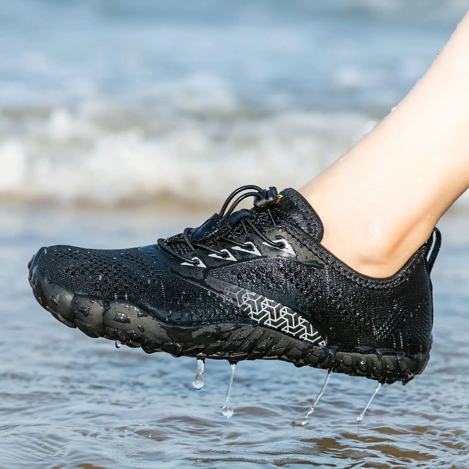 Simples Market black trail running shoe with rugged lug sole and water droplets