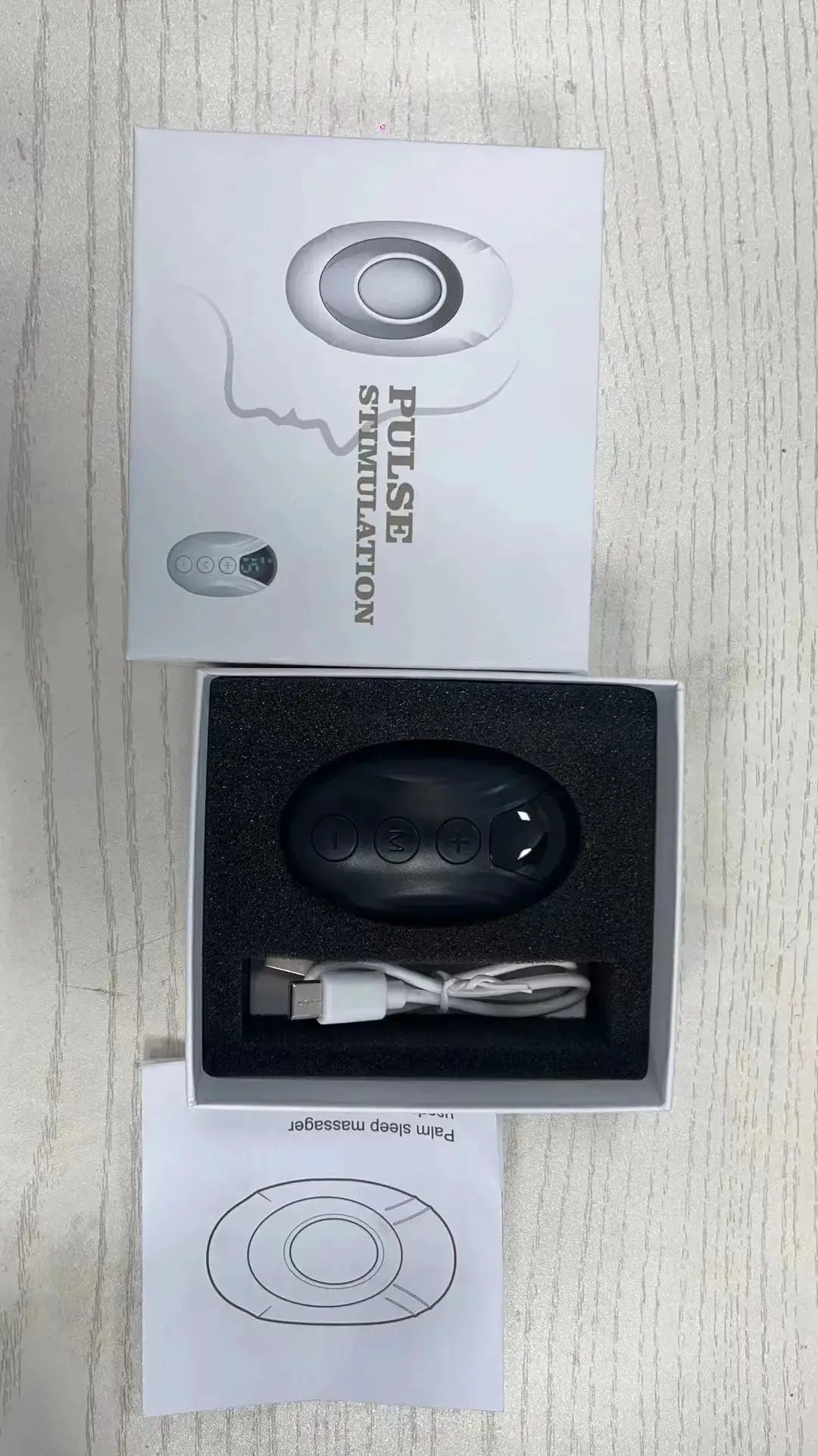 Sleep aid handheld device by Simples Market, black with control buttons, 2-piece set with USB-C cable.