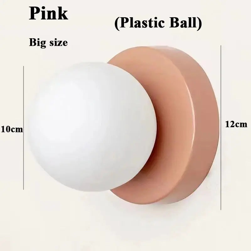 Macaron soft-style wall lamp with pink iron base and white plastic ball shade