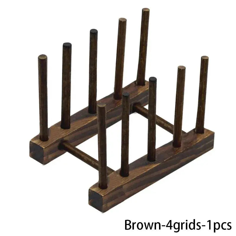 Brown wooden dish drying rack with multiple pegs for drying and organizing tableware.