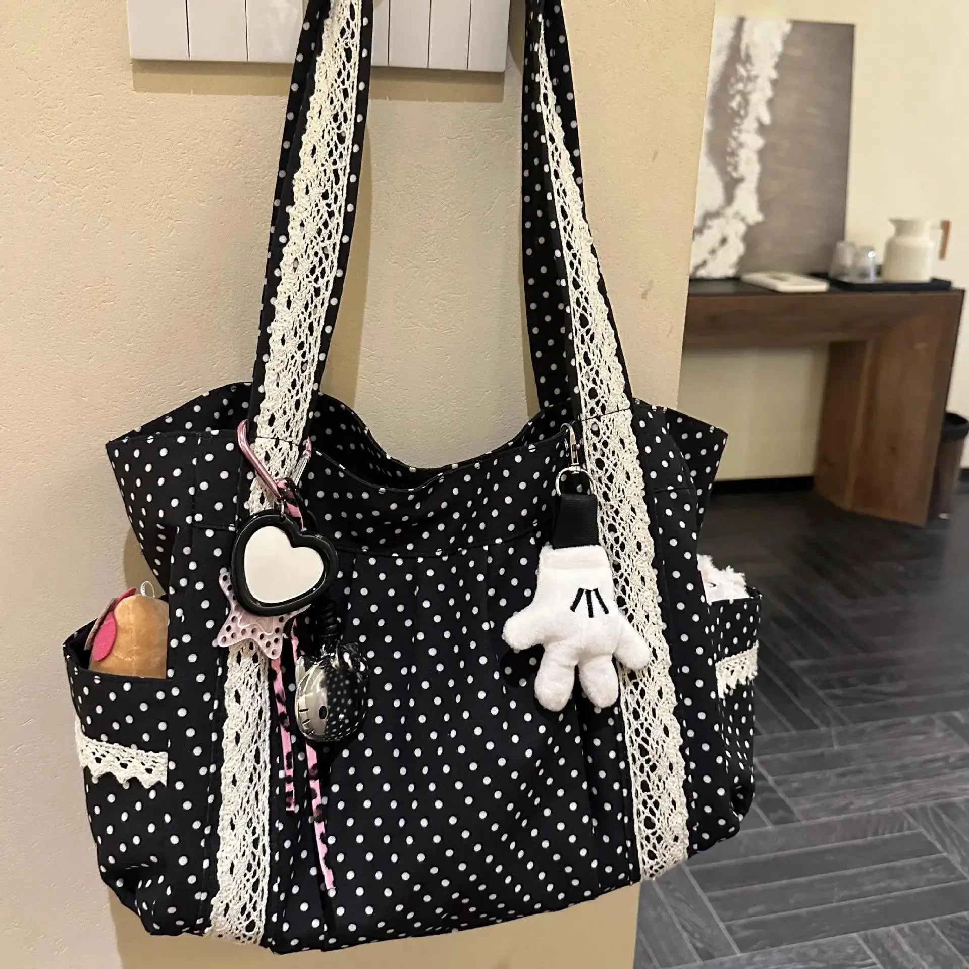 Korean vintage canvas shoulder bag for women; black polka-dot tote with white lace trim and multi-pocket design