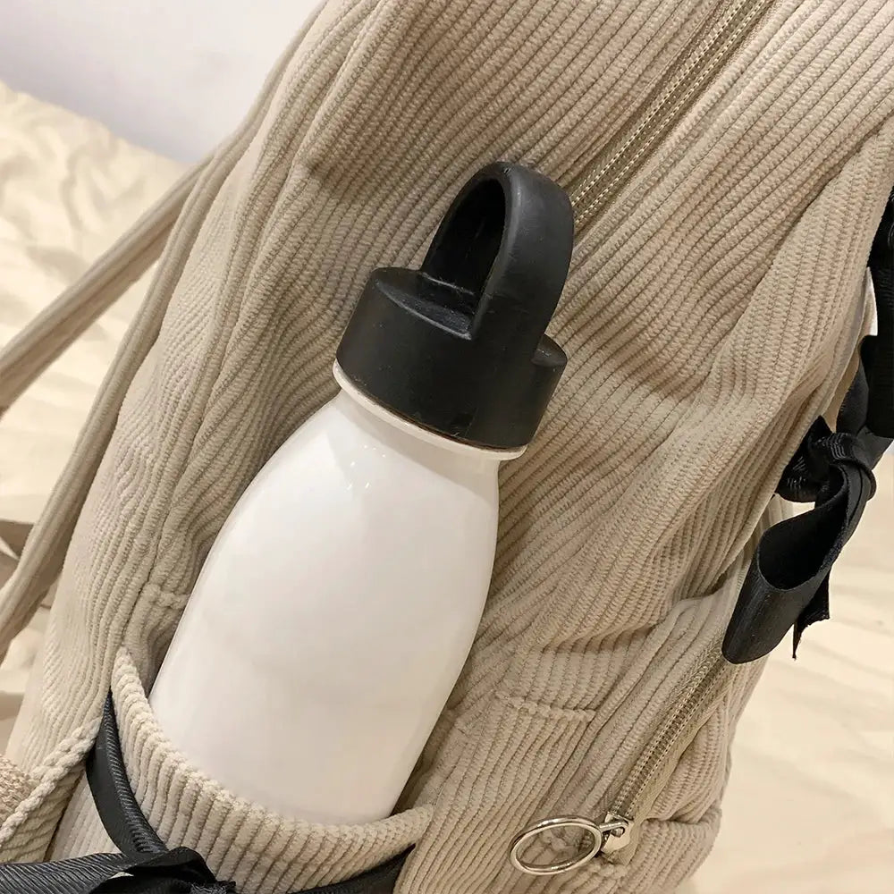 Korean Ins backpack in beige corduroy with side water bottle pocket.