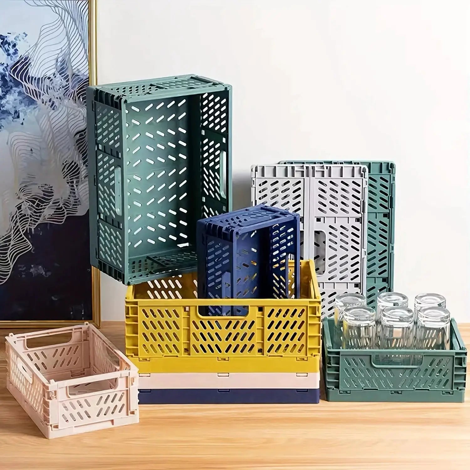 Plastic foldable storage crates, set of 8 in assorted colors; stackable, ventilated organizer boxes.