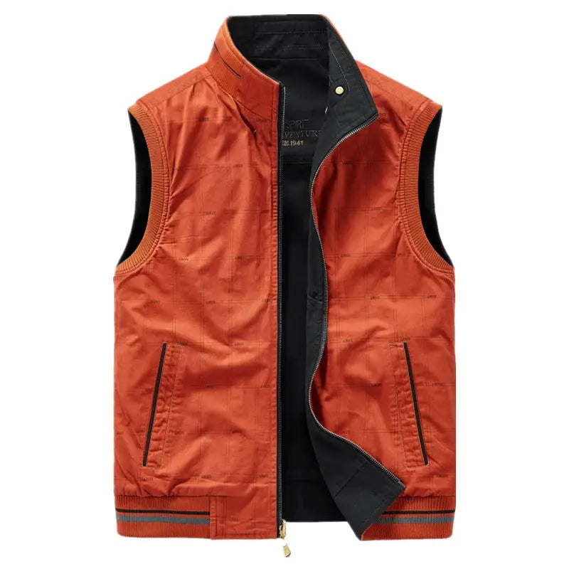 Men's orange cotton waistcoat with multiple pockets; black lining and zip closure.
