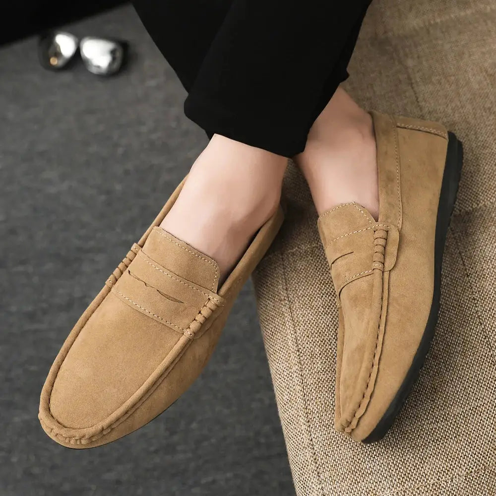 Men's khaki suede driving loafers with black rubber outsole, stitched moccasin toe, casual slip-on shoes