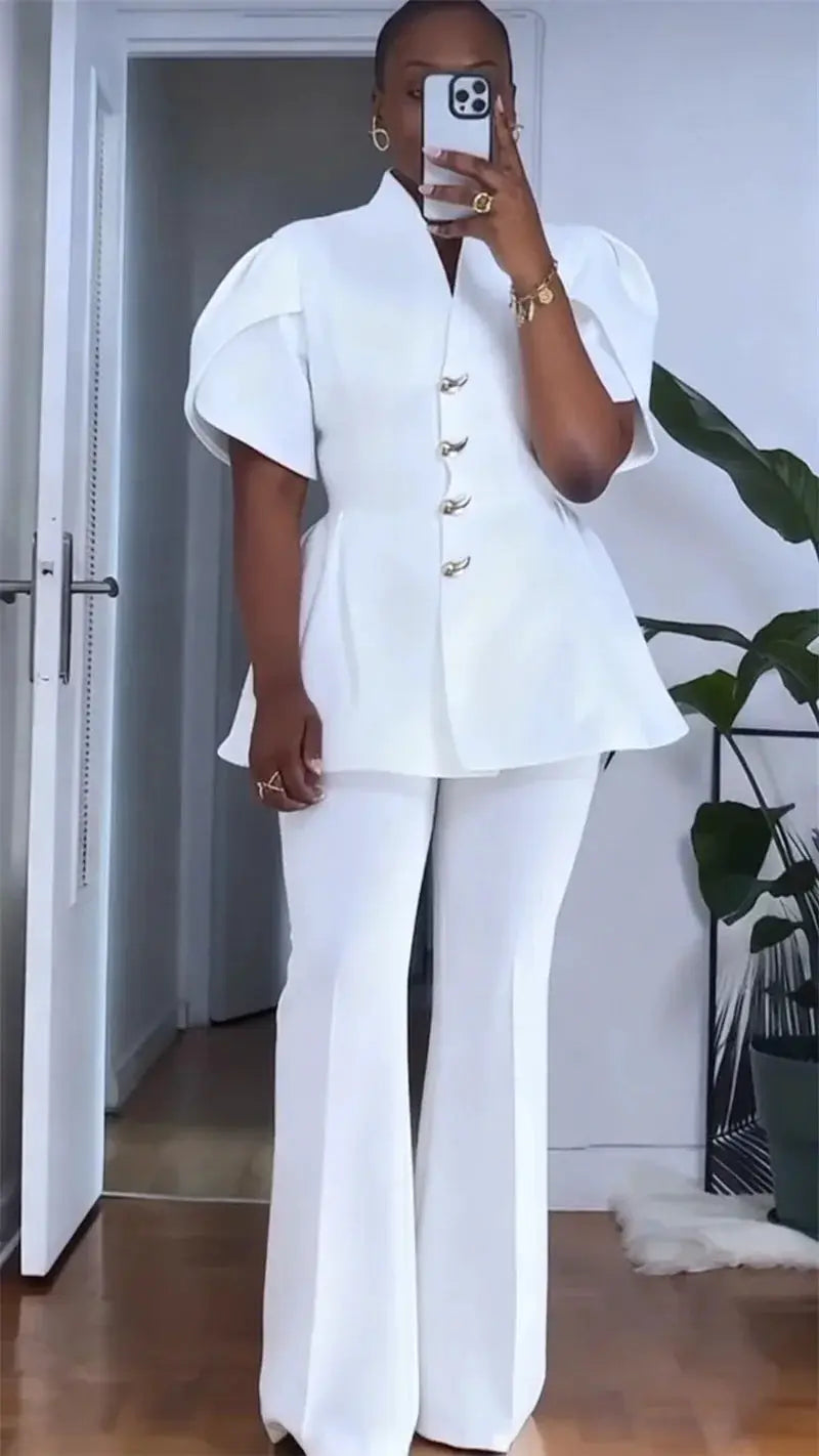Two-piece white blazer set with puff sleeves and wide-leg pants by Simples Market