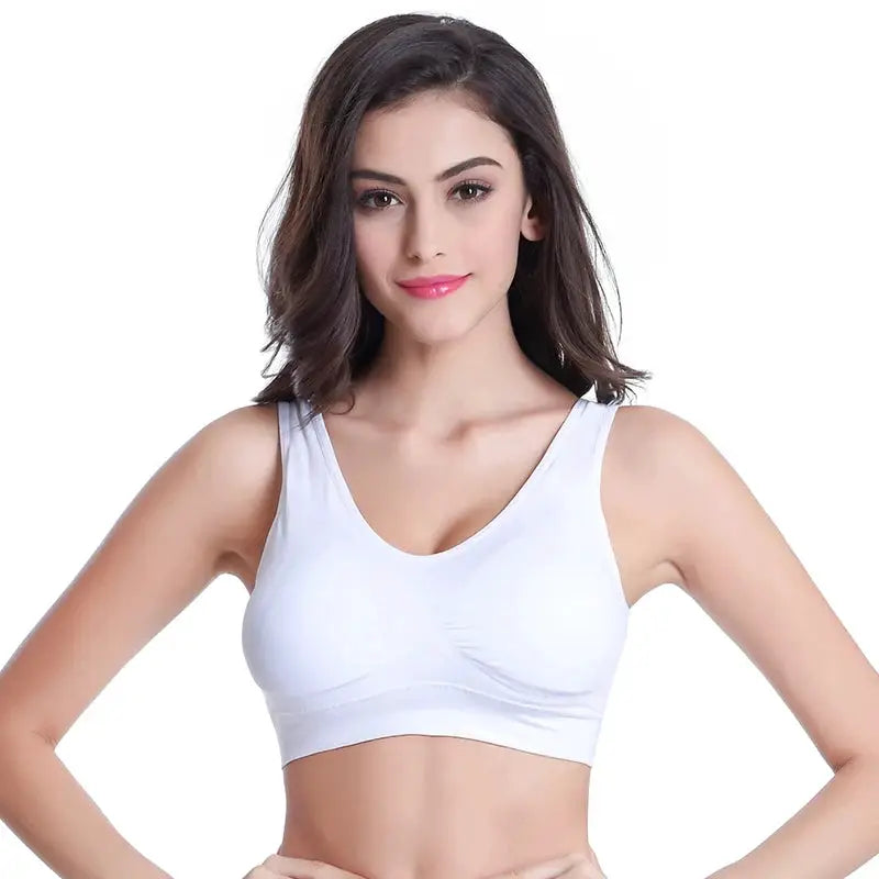 Sports bra, white wireless seamless design, modeled by woman for gym and yoga workouts.