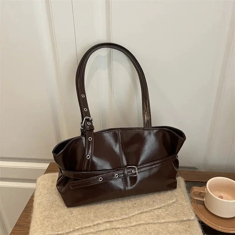 Leather handbag with belt buckle strap in dark brown glossy leather, women's casual shoulder bag