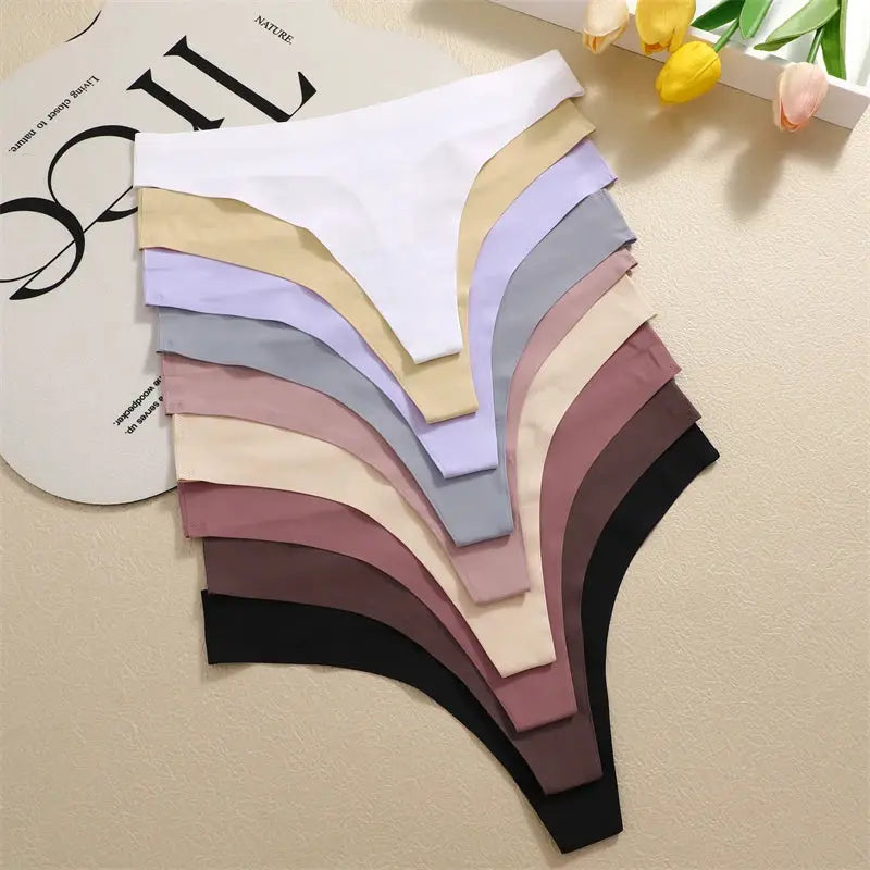 Seamless women's underwear assortment in white, beige, lavender, gray, pink, and black.
