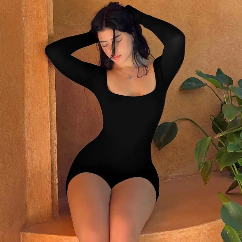 Hugcitar long-sleeve black playsuit by Simples Market, slim-fit one-piece with square neckline