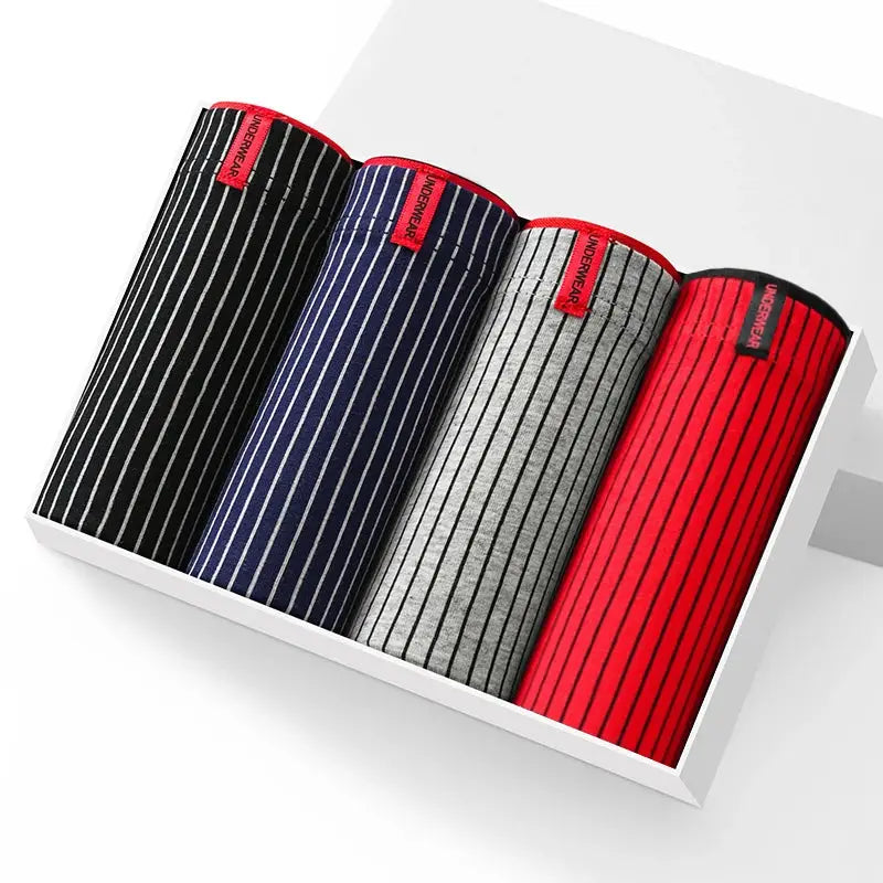 4-pack men's striped cotton boxer shorts set in black, navy, gray, and red, neatly arranged in a white box