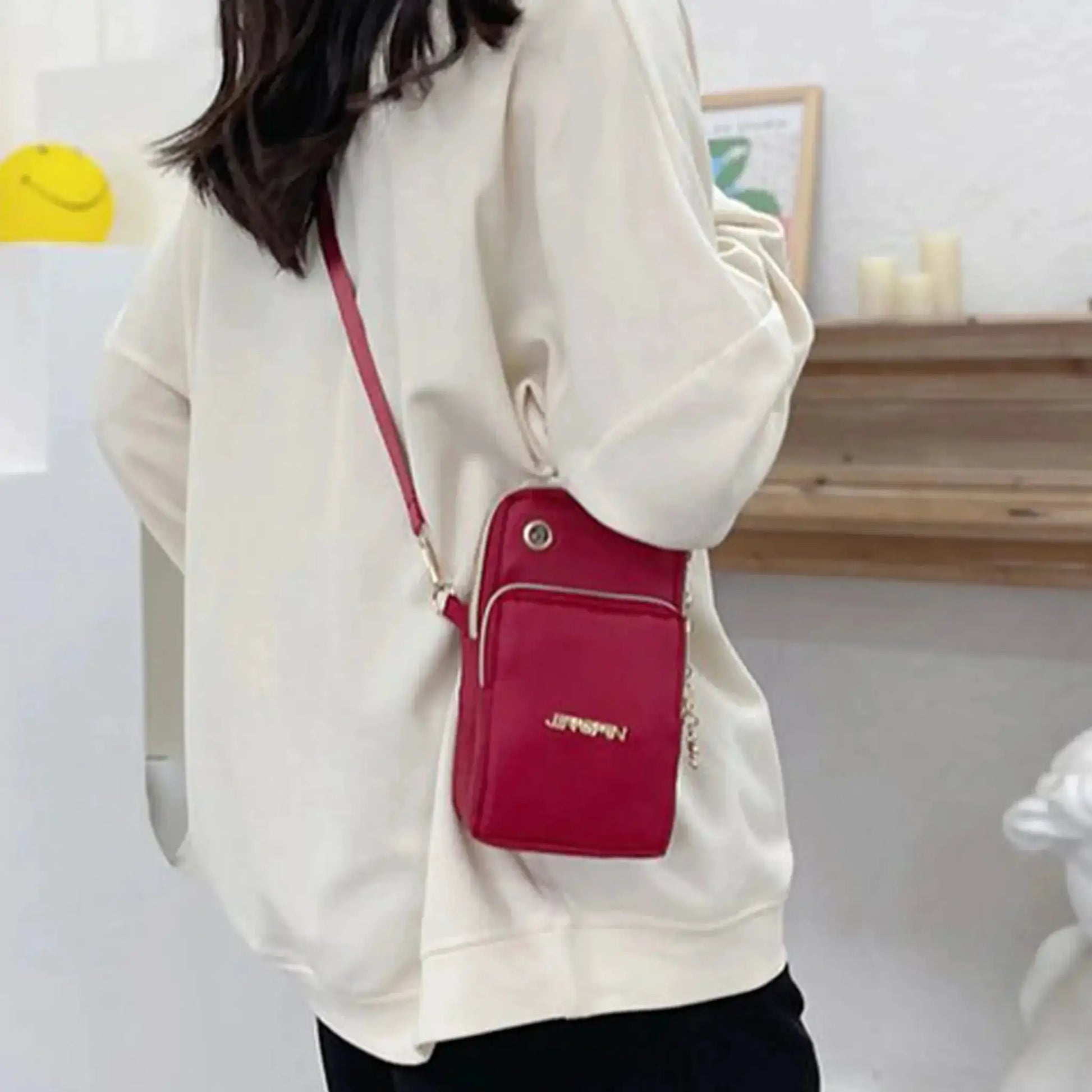 Mobile phone crossbody bag in red with white piping by Simples Market