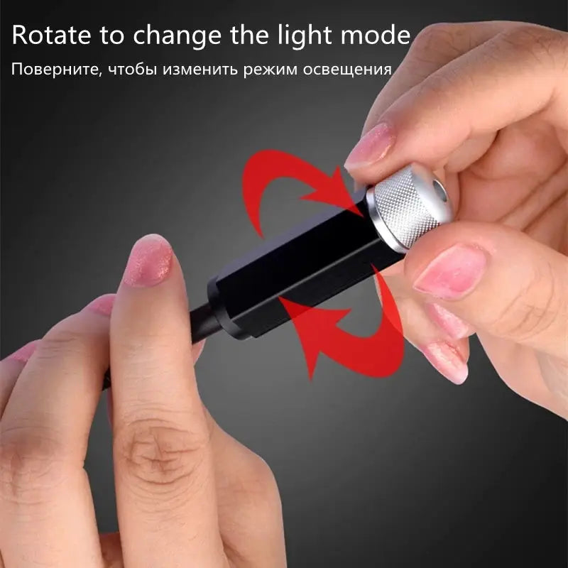 Car starry sky LED night light projector, USB-powered compact black unit with a silver rotary knob.
