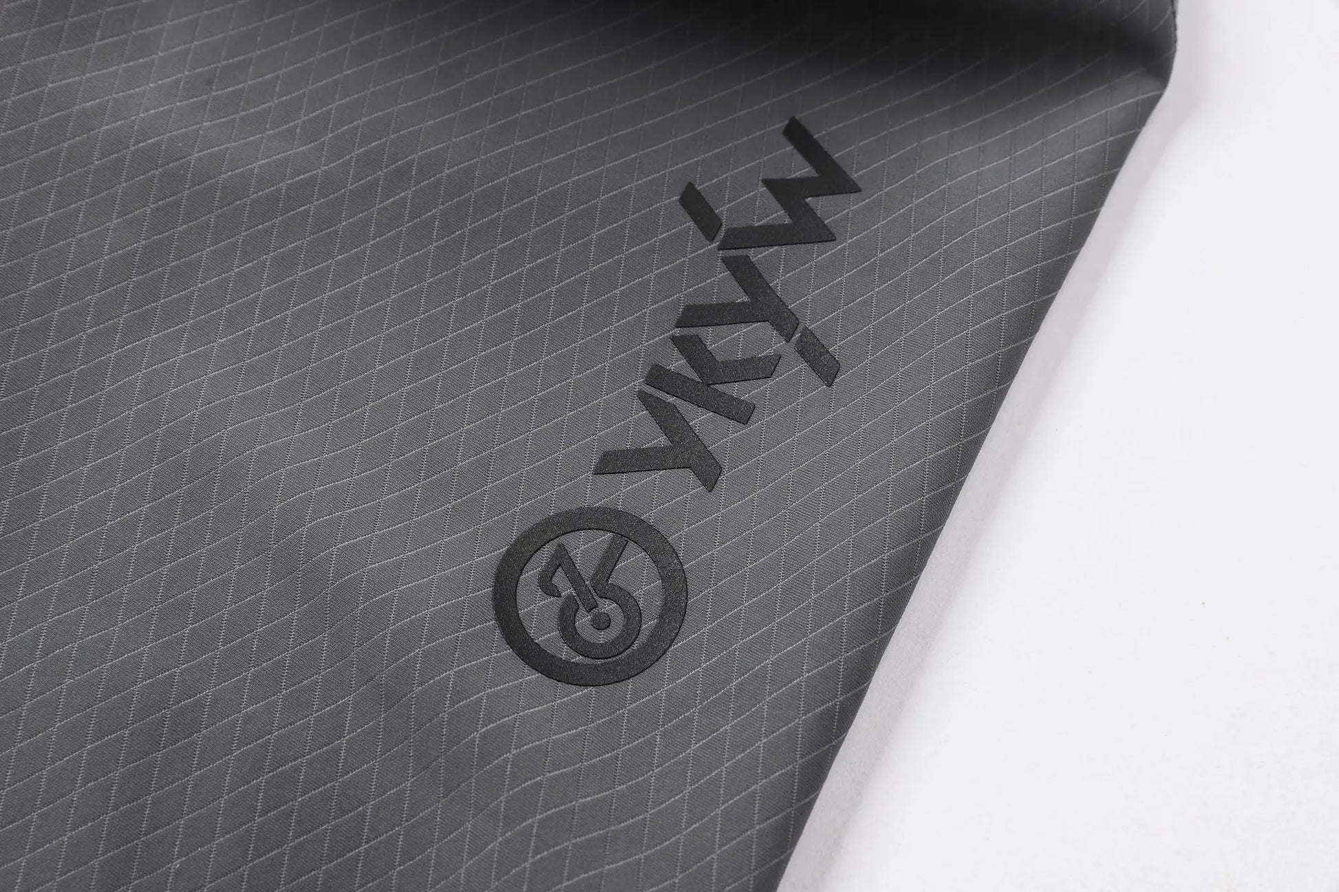 YKYWBIKE cycling bib shorts fabric close-up in dark gray with diamond grid texture