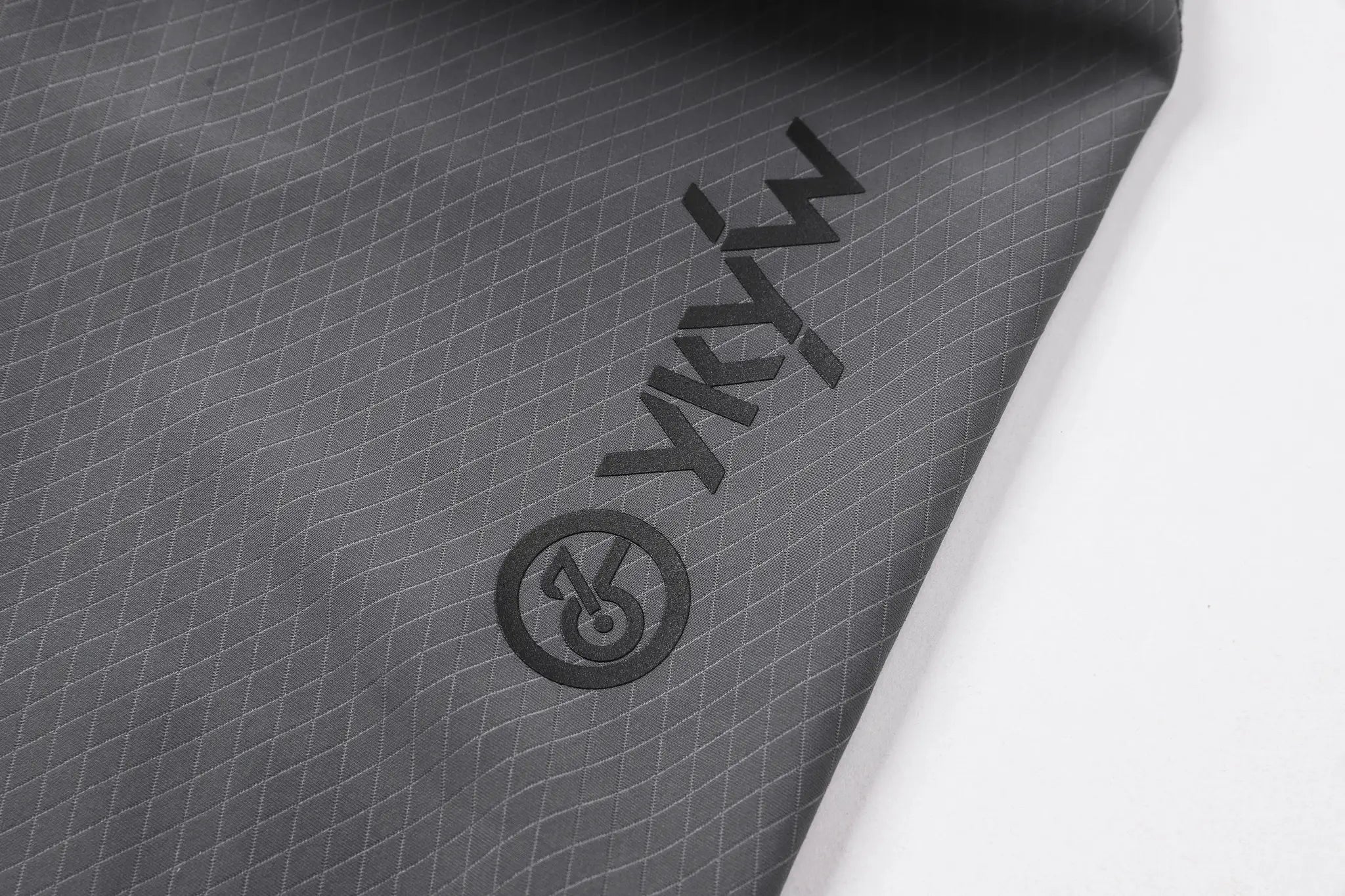 YKYWBIKE cycling bib shorts fabric close-up in dark gray with diamond grid texture