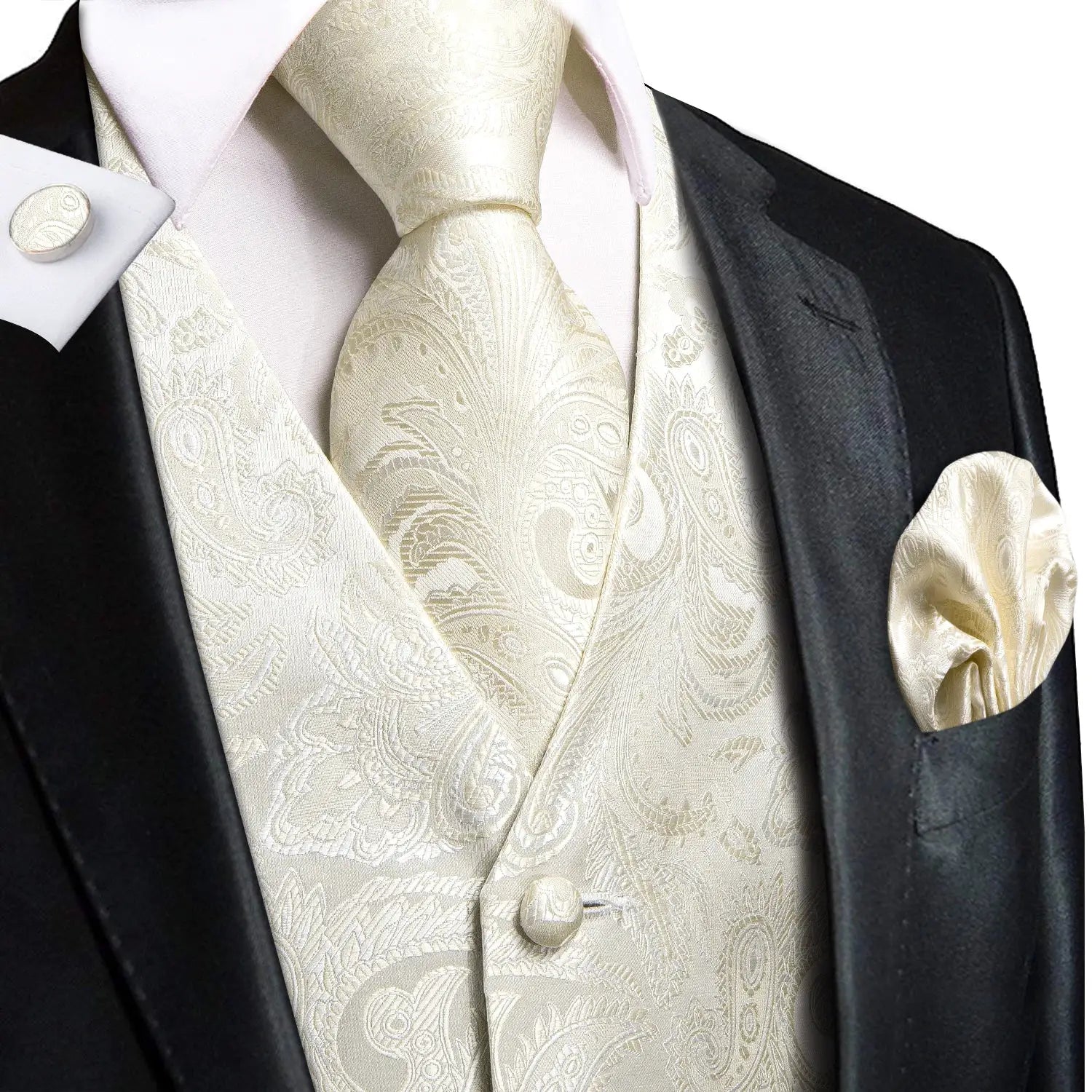 Ivory paisley wedding waistcoat set with matching tie and pocket square, worn with a black tuxedo.