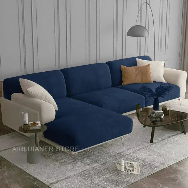 Blue velvet sofa seat cover set on a sectional sofa with beige arms in a modern living room