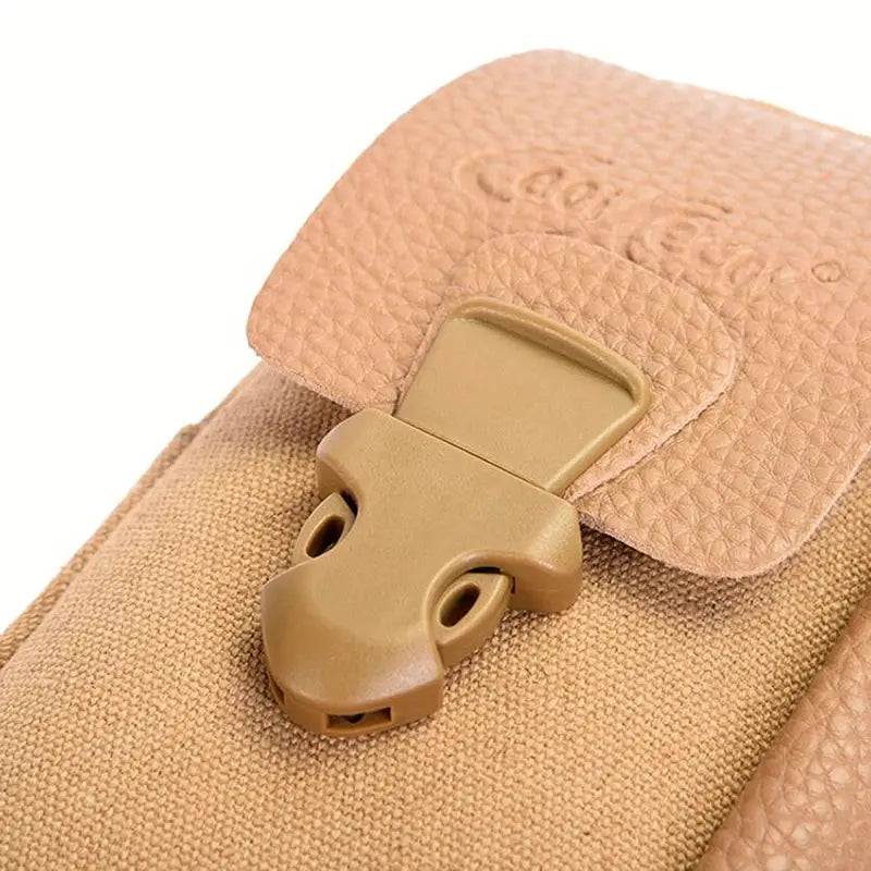 Canvas waist bag in tan with textured faux leather flap and tan plastic buckle