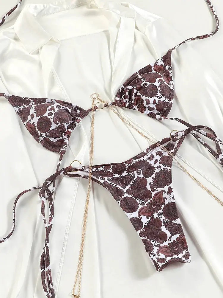 Triangle bikini set by Simples Market with brown floral print and gold chain accents, thong bottom