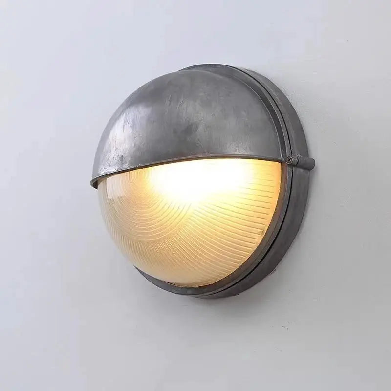 Outdoor retro LED wall lamp with gray metal housing and IP65 waterproof amber ribbed glass diffuser