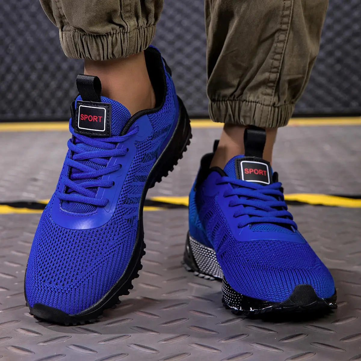 Men's blue lace-up running shoes with breathable knit upper and non-slip black sole
