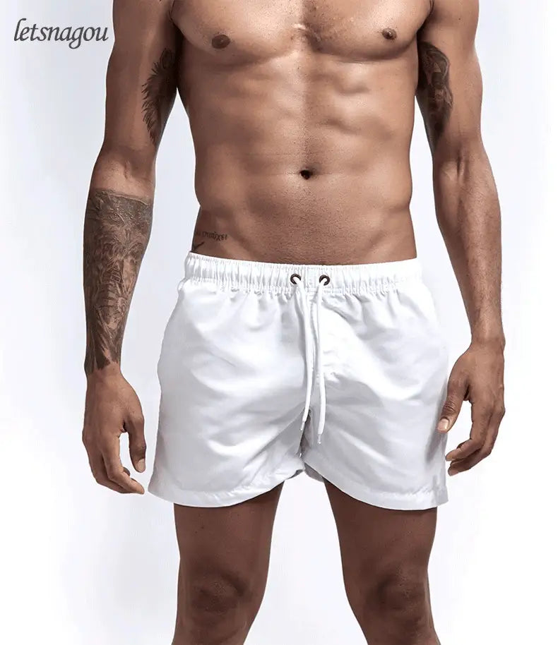 Simples Market men's white quick-dry swim shorts with drawstring.