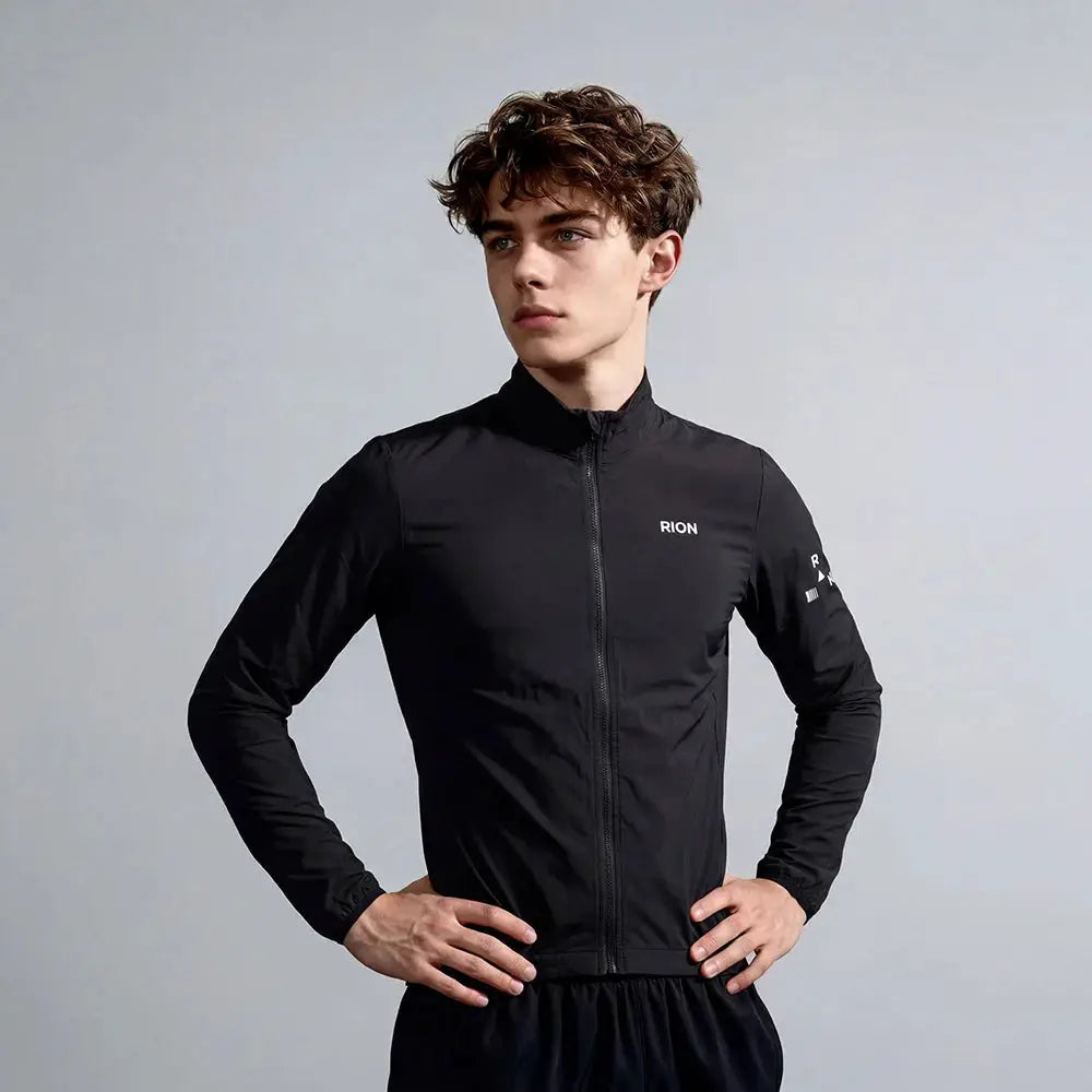 RION men's black lightweight windbreaker jacket with full-zip front and stand collar