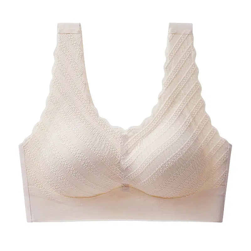 Seamless wireless sports bra crop top in cream beige with textured knit and wide straps.