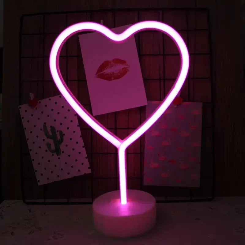 Neon sign heart-shaped USB LED lamp with pink glow on a white base, decorative night light for kids' rooms.