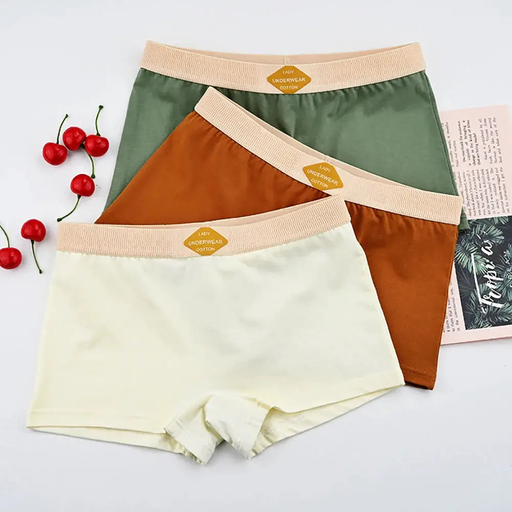 Three-pack cotton women's boxer shorts mid-rise in ivory, brown, and green with beige elastic waistband