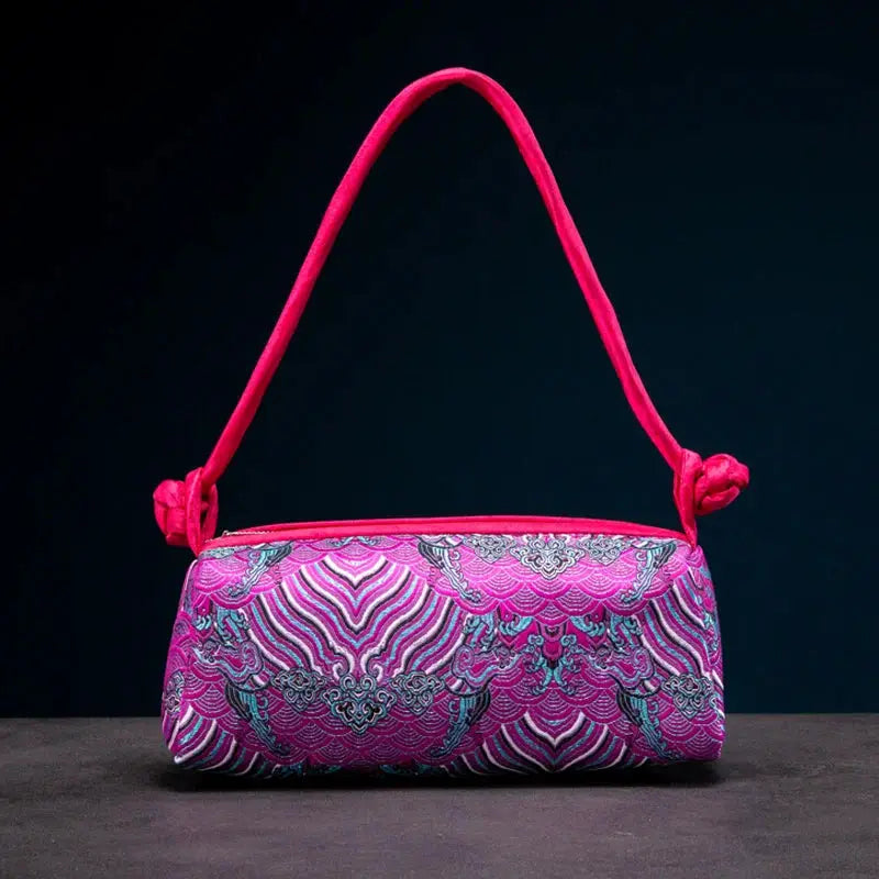 Simples Market fashion shoulder bag for women with embroidered silk floral pattern in pink and purple, pink strap.