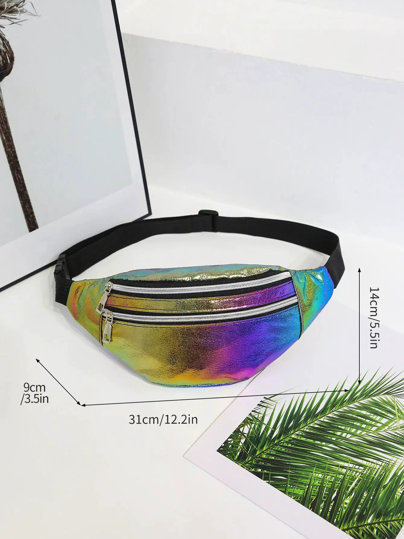 Holographic fanny pack with black adjustable strap, rainbow metallic surface and dual silver zippers