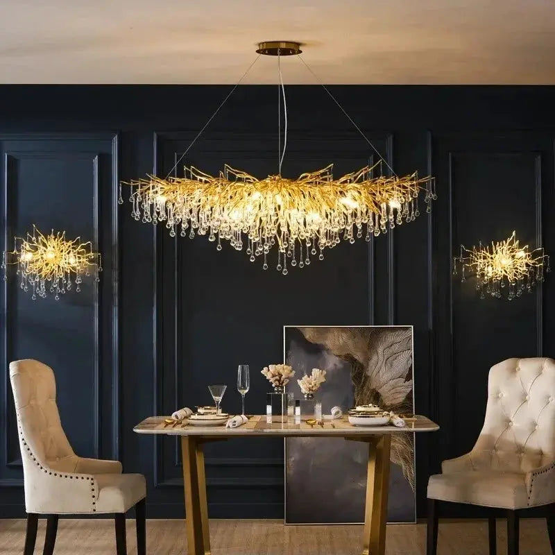 Royal Nordic luxury crystal chandelier, gold chrome with water-drop crystals, suspended above a formal dining table