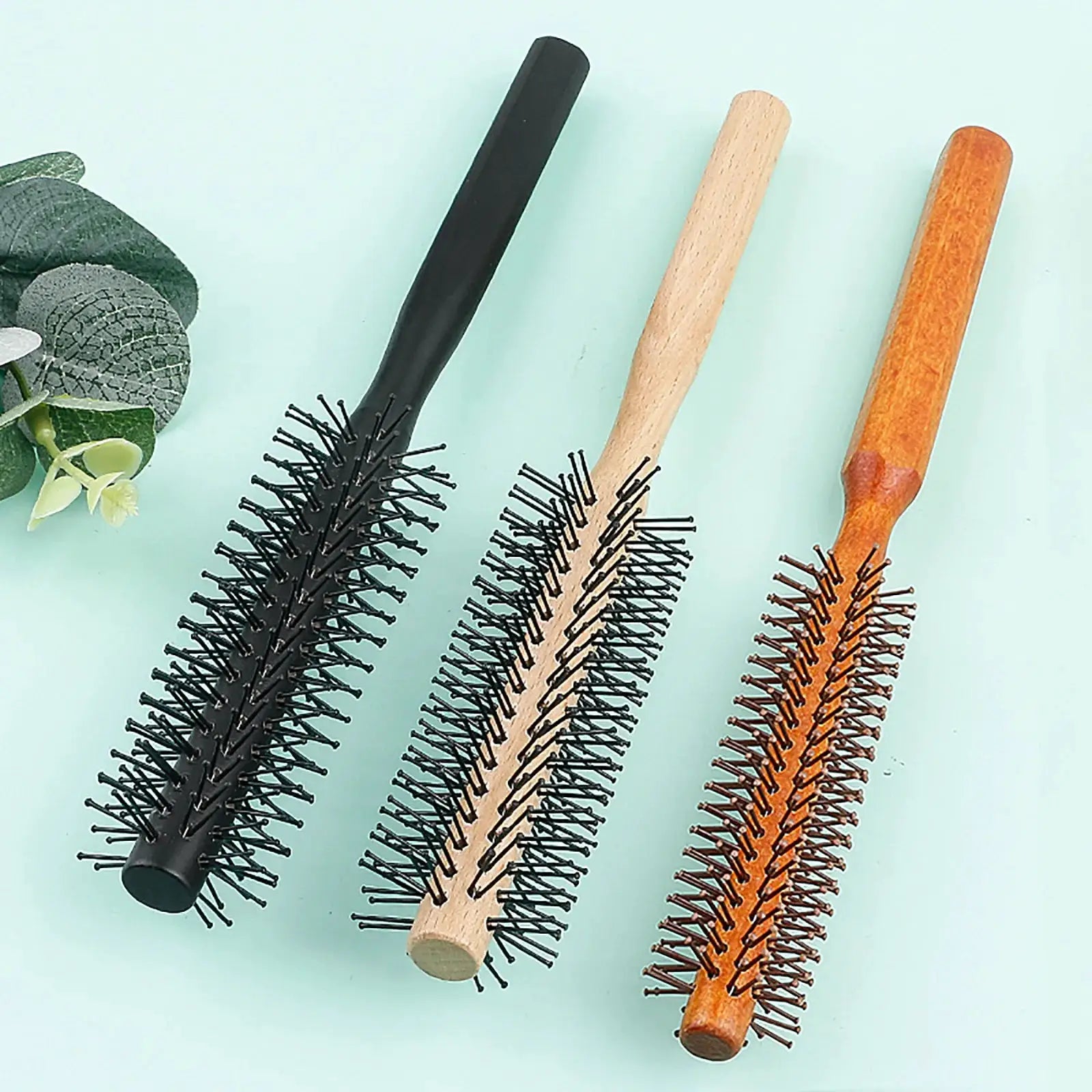 3 wooden-handle circular hair brushes with nylon teeth in black, natural wood and amber