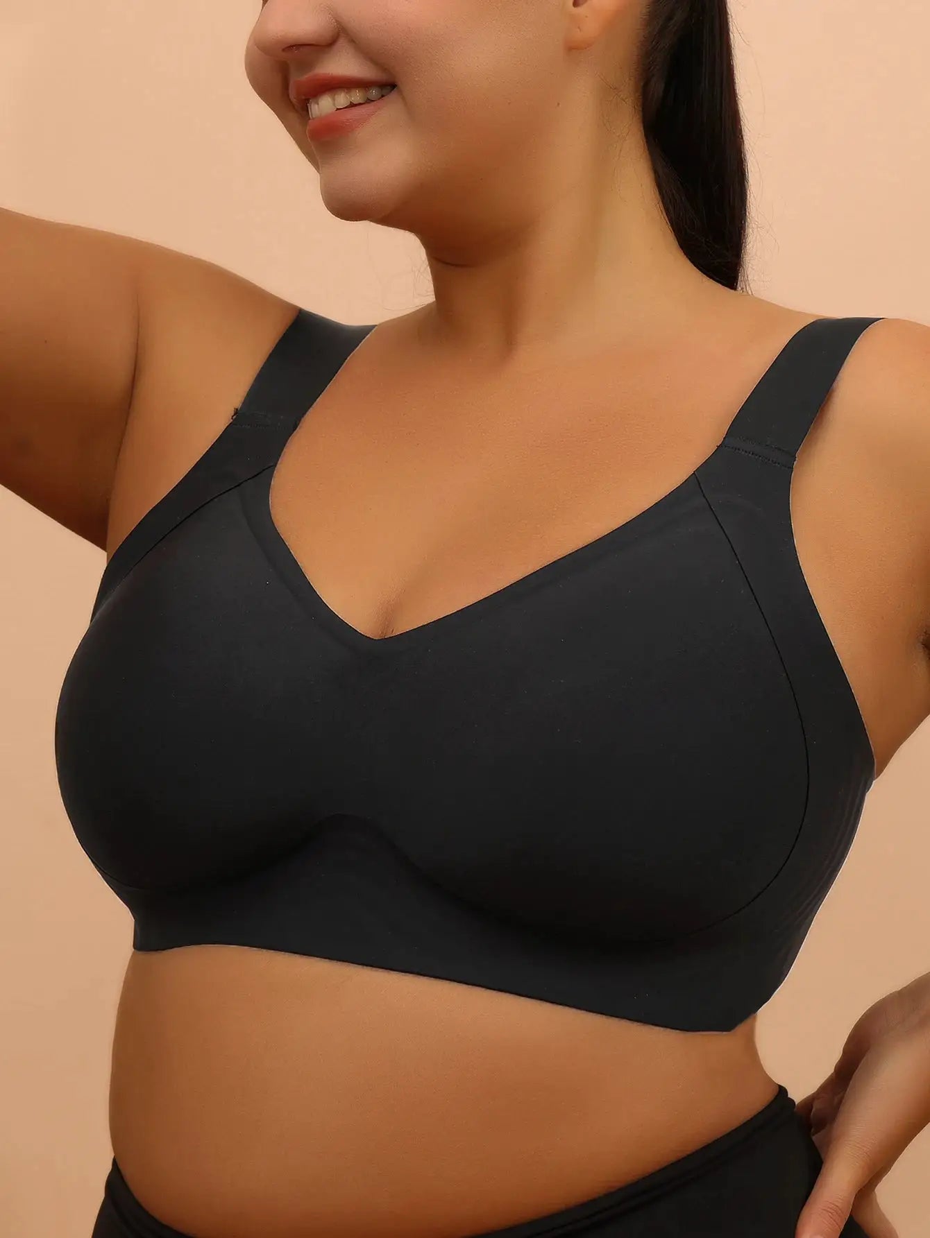 Plus-size black wireless sleeping bra with wide straps, seamless and supportive