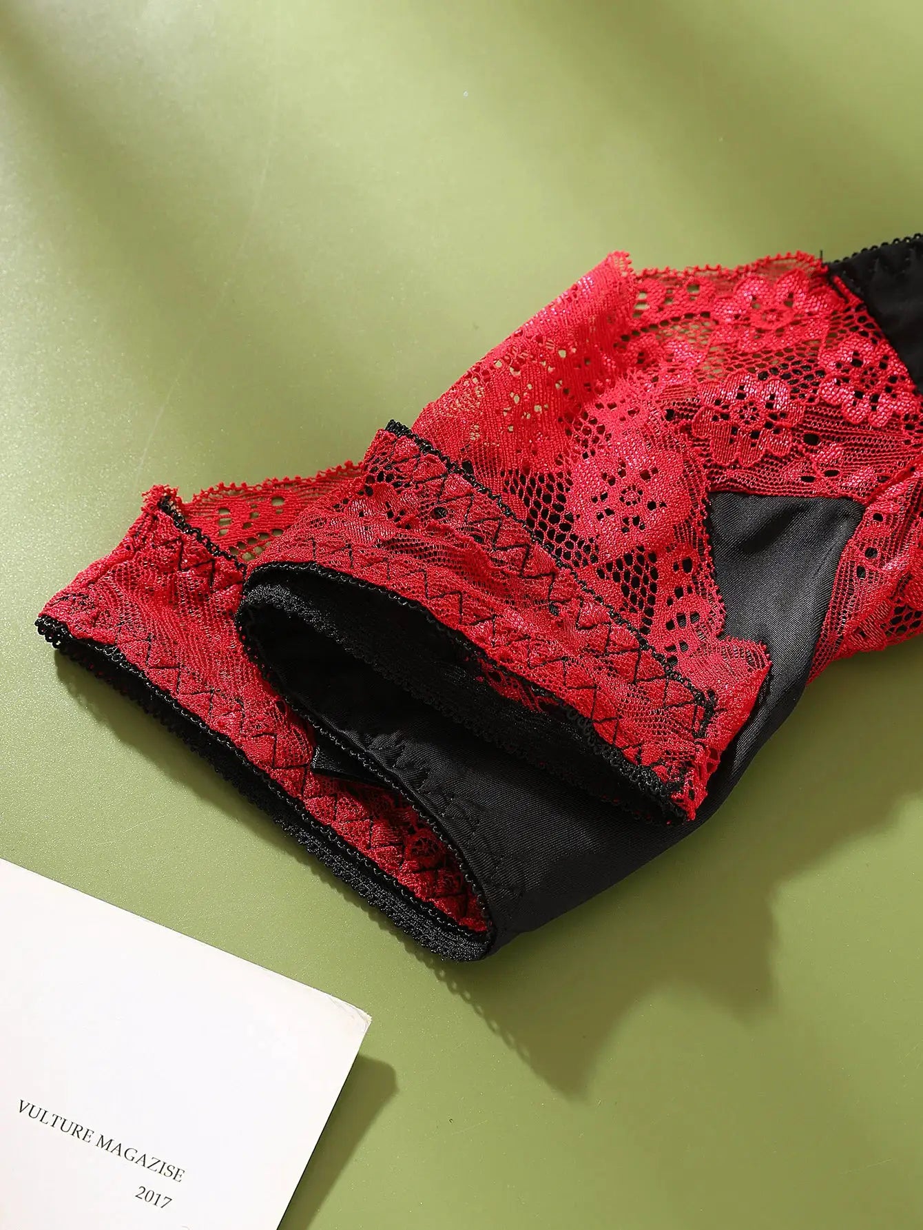Red lace color-block women's underwear with black panel; mid-rise, sheer breathable briefs.