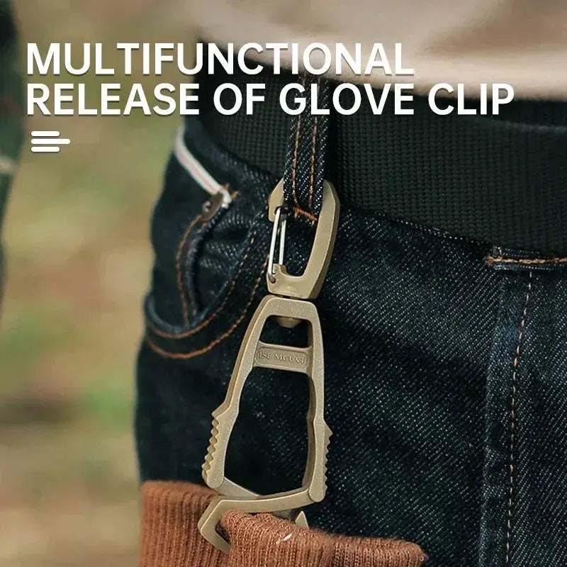 Glove clip hanger by Simples Market in beige metal, attached to belt loop on jeans for outdoor work gloves