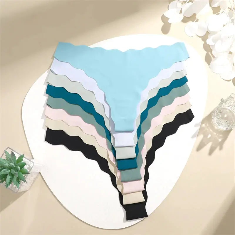 4-piece seamless women's thong underwear set in assorted colors, low-waist G-string.