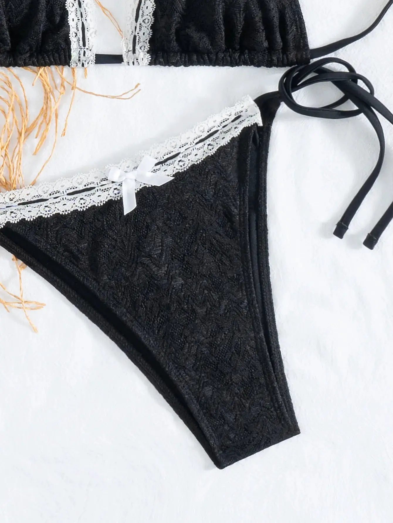 Simples Market triangle bikini set in black lace with white lace trim and bow, top and Brazilian bottoms.