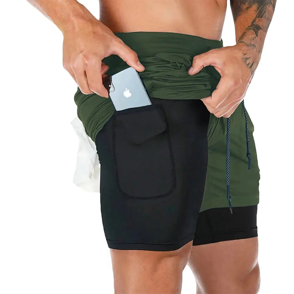 Men's fitness training shorts, 2-in-1 quick-dry gym shorts, green/black with side pocket holding a phone