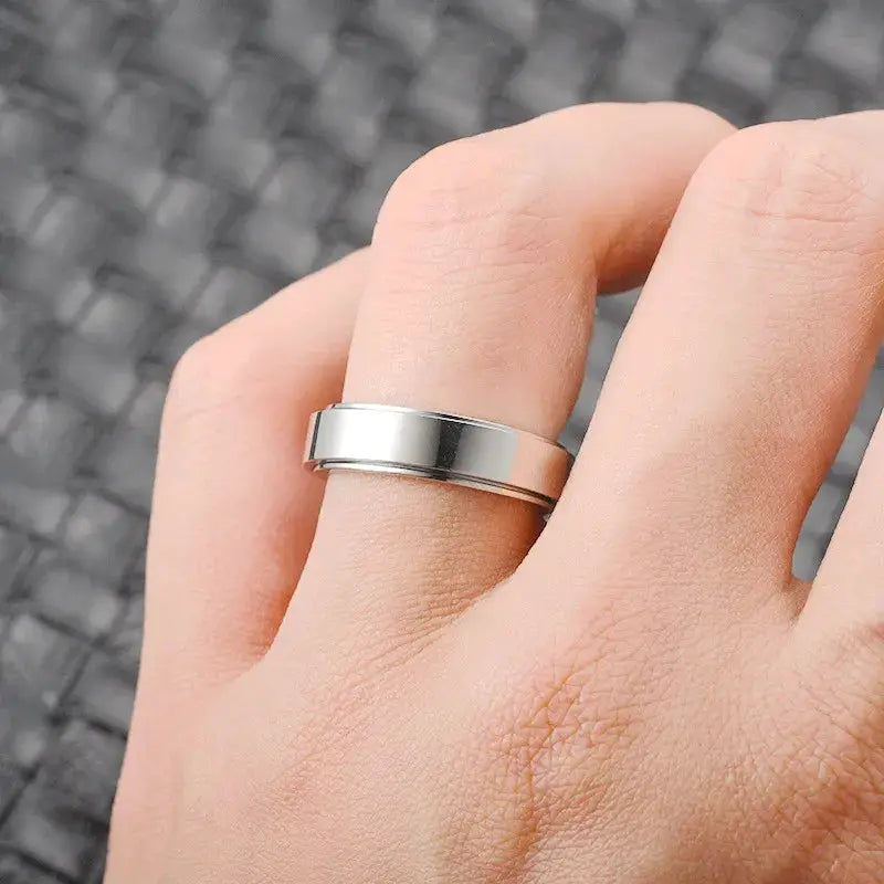 Stainless steel knuckle ring with a wide silver band, unisex wedding jewelry