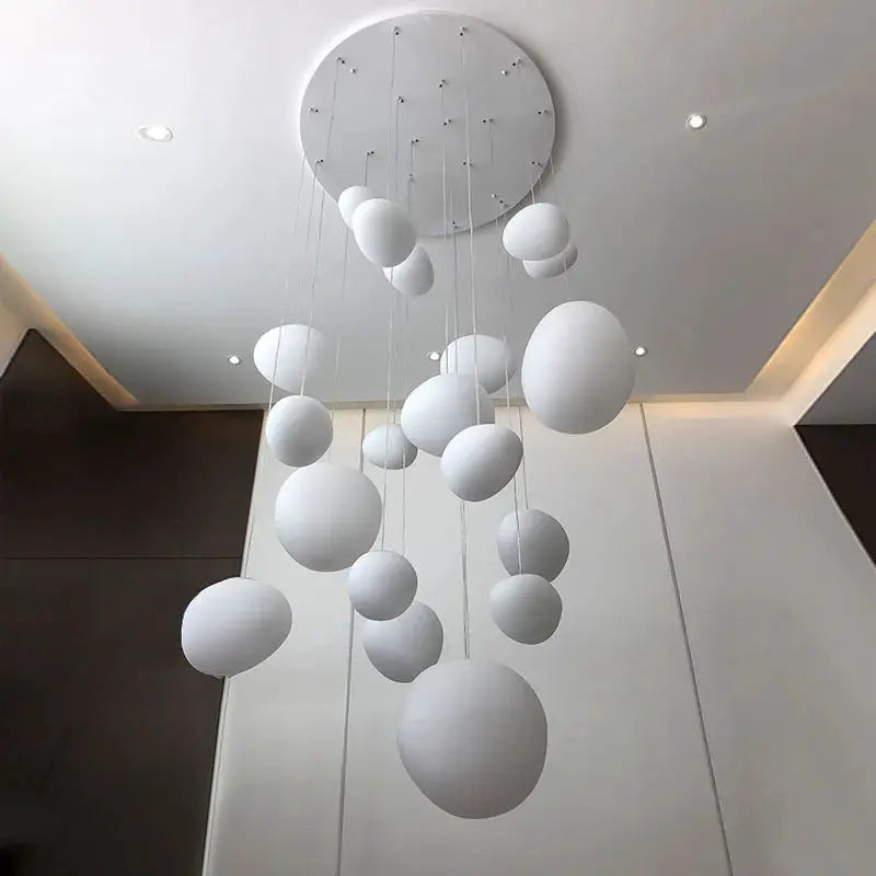 Nordic white glass ball pendant light with multiple suspended spheres from a round ceiling mount