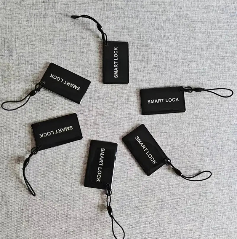 Six black proximity IC cards labeled SMART LOCK with attached lanyards.