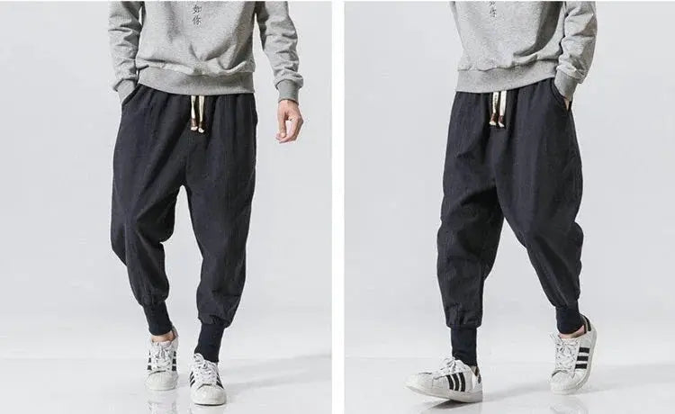 Men's cotton-linen harem joggers in dark navy with drop-crotch, cuffed ankles, and drawstring waist by Simples Market