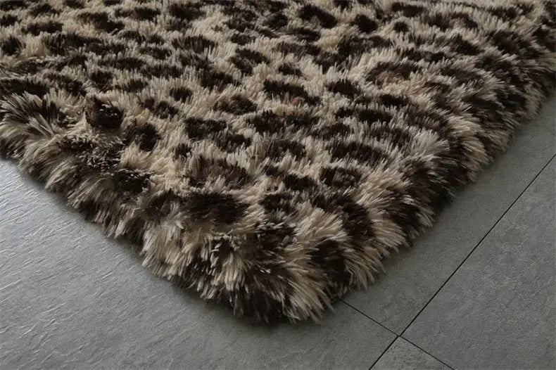 Premium fluffy shag area rug in black and cream tones, plush indoor living room carpet.