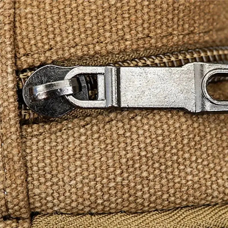 Canvas waist bag in brown fabric with metal zipper; durable, high-capacity outdoor phone purse